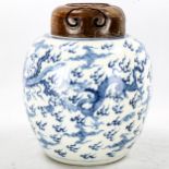 A Chinese blue and white porcelain dragon jar, with hardwood cover, height 24cm Jar is in perfect