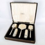 An Art Deco 5-piece silver-backed brush and mirror set, boxed