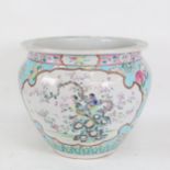 A Chinese jardiniere with enamelled decoration, signed, height 26cm