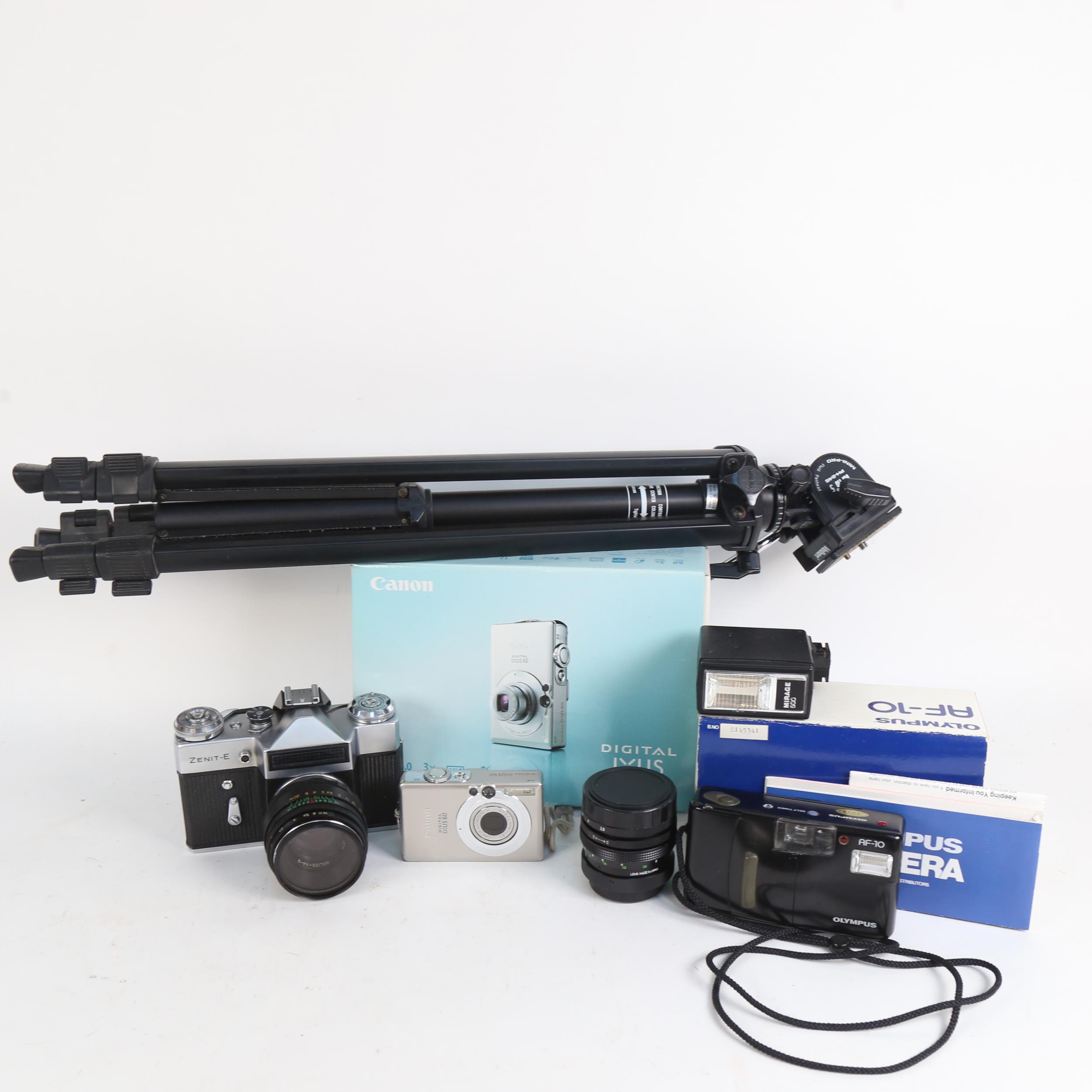 Various cameras and accessories, including Olympus AF-10, Zenit-E, Velbon D-400 tripod etc