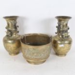 A pair of Chinese cast-brass baluster dragon vases, and a small cast-brass dragon bucket, vase