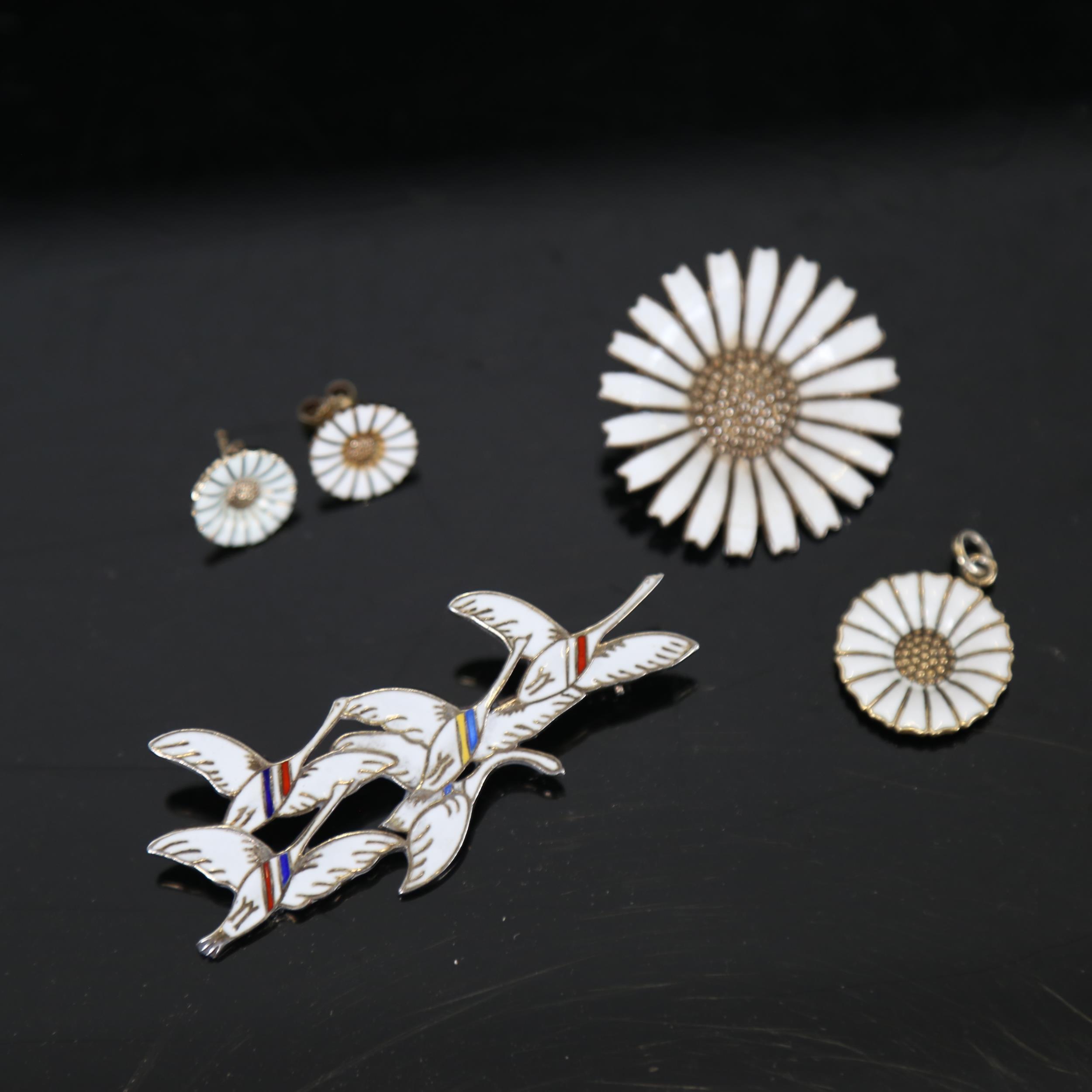 ERIK MAGNUSSEN - silver and white enamel Eneret brooch, a pair of white enamel and silver-gilt