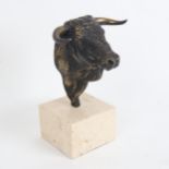 A reproduction bronze bull's head sculpture, unsigned, on white marble base, overall height 20cm