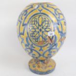 Large Islamic tin-glaze terracotta egg vase, height 46cm (A/F)