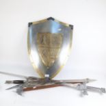 A reproduction steel and brass-mounted shield, 2 reproduction swords, and an axe (for display