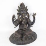 A large Chinese patinated bronze seated Ganesh God figure, on lotus base, height 43cm