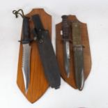 A Second World War USM8 Camillus knife in sheath, and a Commando knife in sheath, both with wall