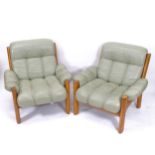 A pair of mid-century leather-upholstered lounge chairs, width overall 88cm, H80cm, depth overall