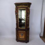 An Egyptian Revival design display cabinet, with a single-glazed and panelled cupboard door, and