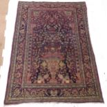 A red ground Persian Tree of Life design rug, 212cm x 142cm