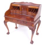 A mahogany Chippendale style writing desk with bureau fittings, having 2 frieze drawers, on cabriole