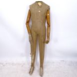 A Vintage French shop mannequin with poseable wooden arms, H150cm