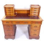 A Victorian mahogany twin-pedestal writing desk, with gallery and brown leather skiver, W122cm,