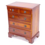 A reproduction mahogany and satinwood-strung chest of 2 short and 3 long drawers, on bracket feet,