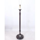 A fluted mahogany standard lamp, height to top of bayonet fitting 144cm