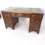 A reproduction mahogany twin-pedestal writing desk, W138cm, H78cm, D69cm