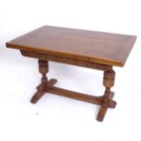 An oak draw leaf table with carved frieze, and baluster legs, W122cm extending to 182cm, H77cm,