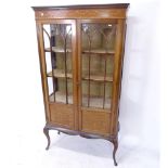 An Edwardian mahogany and satinwood-banded glass display cabinet, with 2 glazed and panelled