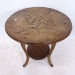 A carved beech circular 2-tier lamp table, W53cm, H70cm One leg repaired, a lot of movement in the