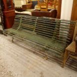 A green painted cast-iron garden bench, L195cm from Arras, France