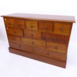A modern mahogany chest of 13 drawers, W130cm, H85cm, D43cm