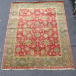 A cream and red ground Persian design carpet, with symmetrical pattern, 322cm x 254cm Carpet is in