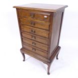 An Antique mahogany music cabinet, with 6 drawers, on cabriole legs, W53cm, H90cm, D40cm