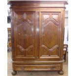 A very large and impressive 2-section fruitwood 2-door armoire, with a single frieze drawer below,