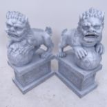 A pair of composite Dogs of Fo on pedestal stands, H47cm