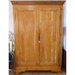 A large polished pine 2-door wardrobe, W155cm, H217cm, D58cm, with key 2 sectional with removable