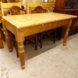 A rectangular pine kitchen table, on turned and fluted legs, W173cm, H78cm, D78cm