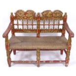An Antique Indian 2-seat marriage chair/bench, with rush seat and allover painted decoration, W100cm