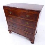 An early 20th century walnut bachelor's chest, with brushing slide and 4 long drawers under, on
