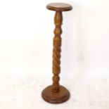 A mahogany candles stand, on a spiral turned column and platform base, H92cm