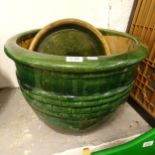 A large green glaze terracotta garden pot, with base, W50cm, H36cm