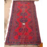 A red ground Turkey rug (A/F), 283cm x 150cm