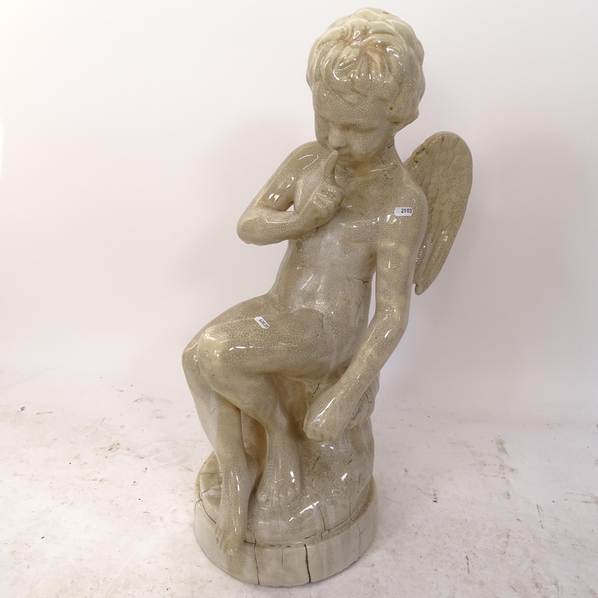 A crackle-glazed statue, study of a winged cherub, H83cm