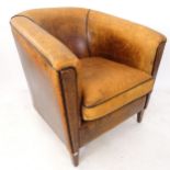 A mid-century design leather tub chair