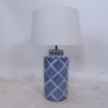 A Chinese blue and white table lamp with white shade, H59cm