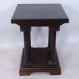 An Antique oak square display stand, with quadruple turned columns, on a platform base with