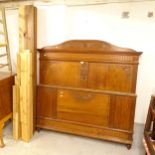 A French carved and panelled oak 4'8" bed, with side rails and slats