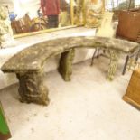 A weathered concrete 4-section curved garden bench, L152cm, H50cm