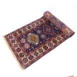 A red and blue ground Turkish design runner, 500cm x 98cm