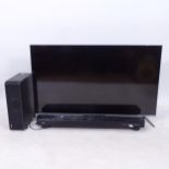 A TCL 50C715K TV, with remote control, and a Yamaha sound bar, GWO