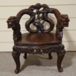 A 19th century Japanese carved wood dragon chair, heavily carved dragon decorated back, relief