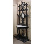 Coalbrookdale cast-iron hall stand, with relief cast decoration, original hooks, inset oval mirror