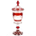 A 19th century Bohemian ruby overlay goblet and cover, with panel depicting the Crystal Palace Great