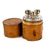 A leather-cased set of 3 silver-topped glass bottles, case height 14cm, diameter 9.5cm (A/F)