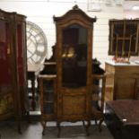 An ornate 19th century walnut and marquetry inlaid vitrine cabinet, flanked by smaller side