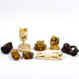 A group of Oriental ivory and wood netsuke, and an ivory stork design stand (8)